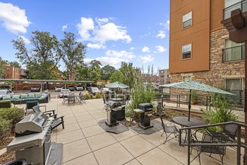 Outdoor living area with gas grills and fire pit